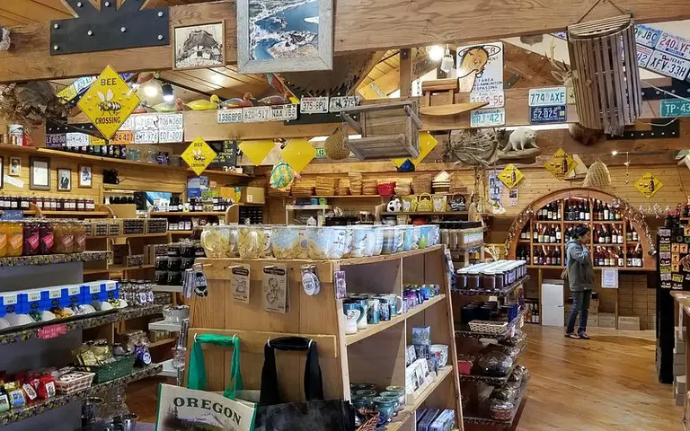 Inside the Misty Meadows store, wood beams hung with license plates over shelves of goods