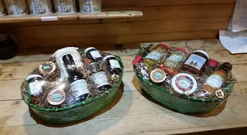 Gift baskets packed with jams and goodies on the store counter