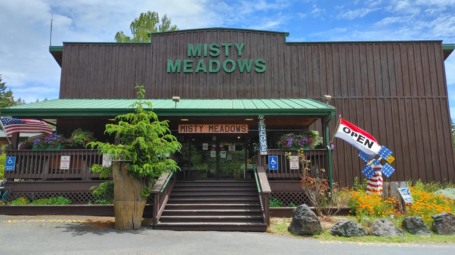 The Misty Meadows store from Highway 101, framed by spruce trees